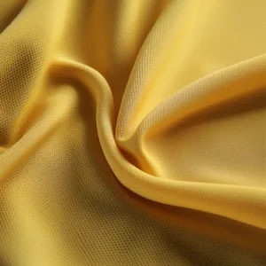 Close-up of textured yellow fabric folds.