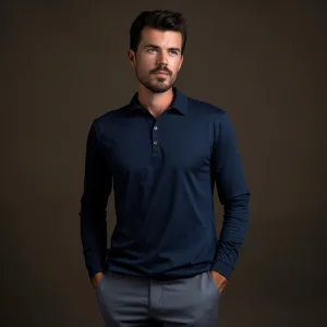 Man in navy polo shirt, studio portrait.