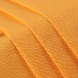 Close-up of textured golden yellow fabric.