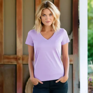 Woman in lavender V-neck T-shirt smiling.