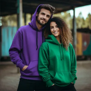 Two people smiling in colorful hoodies.