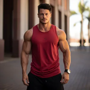 Muscular man in red tank top outdoors.