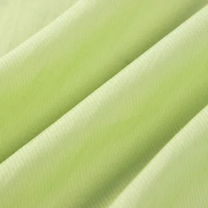 polyester blends Close-up of green textured fabric material.
