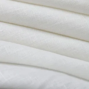 Close-up of white textured fabric folds.