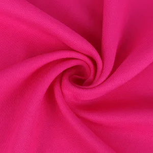 Close-up of twisted pink fabric texture.