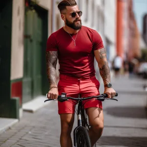 red biker shorts a Man riding bike in urban setting, stylish outfit.