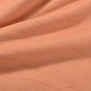 Close-up of textured orange fabric material.