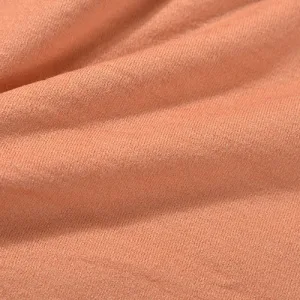wool cashmere Close-up of textured orange fabric material.