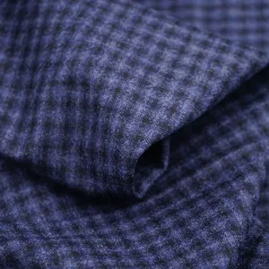 Close-up of textured blue wool fabric.