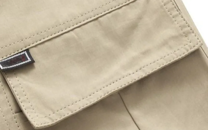 beach short set 6 jpg Close-up of beige pants pocket with label.