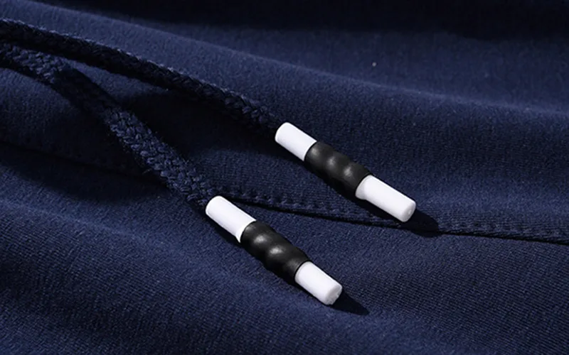 shorts for the beach 9 jpg Black and white shoelaces on blue fabric.