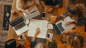 Startup brand owner reviewing hoodie and T-shirt samples with supplier