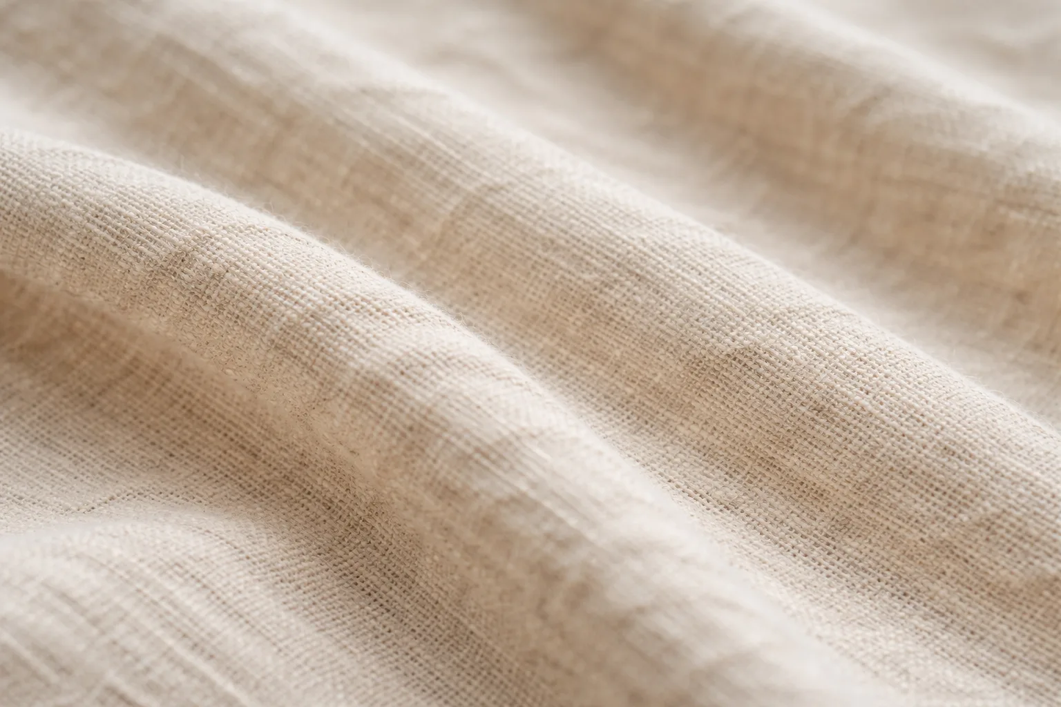 Close-up of hemp-cotton T-shirt fabric showing natural slub weave and fine texture.