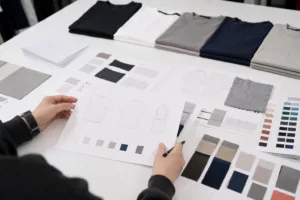 Private label t-shirt line planning with fabric swatches and style sheets