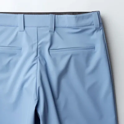 Men's formal blue trousers on white background.
