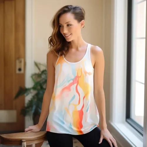 Woman in colorful tank top smiling indoors.