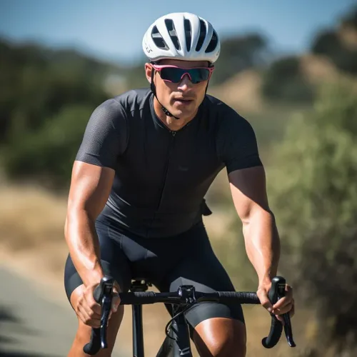 Cyclist in helmet riding on sunny day